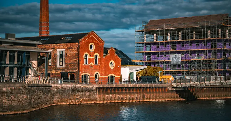 Old brick pumphouse and new flats, River Tawe
