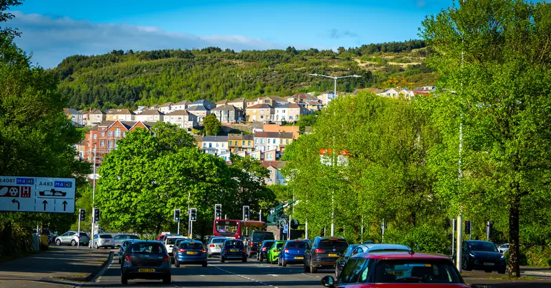 Evening traffic toward the hill