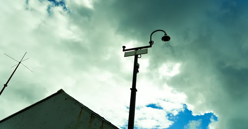 Street lamp and cloud